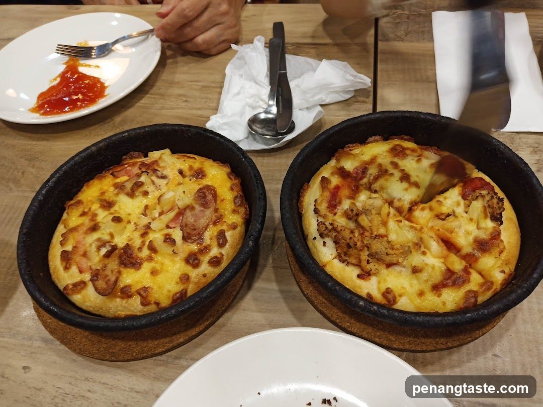 Table with pizzas and utensils