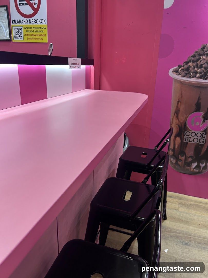 Pink-themed interior of a beverage shop