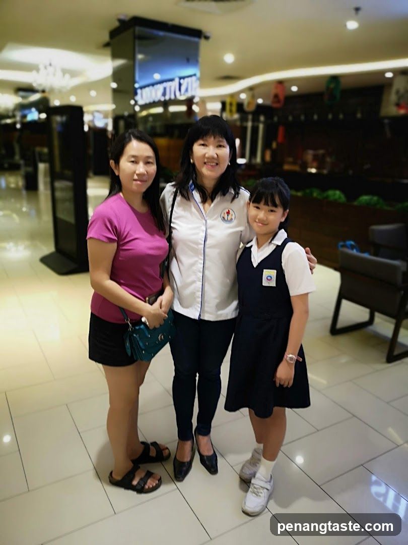 Three people posing indoors