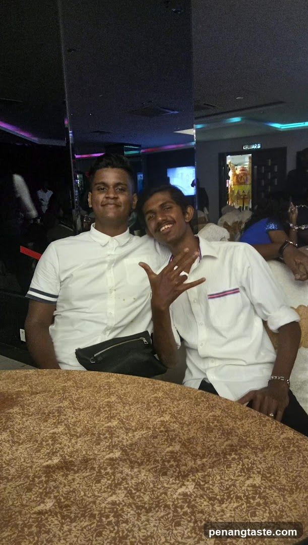 Two men posing indoors