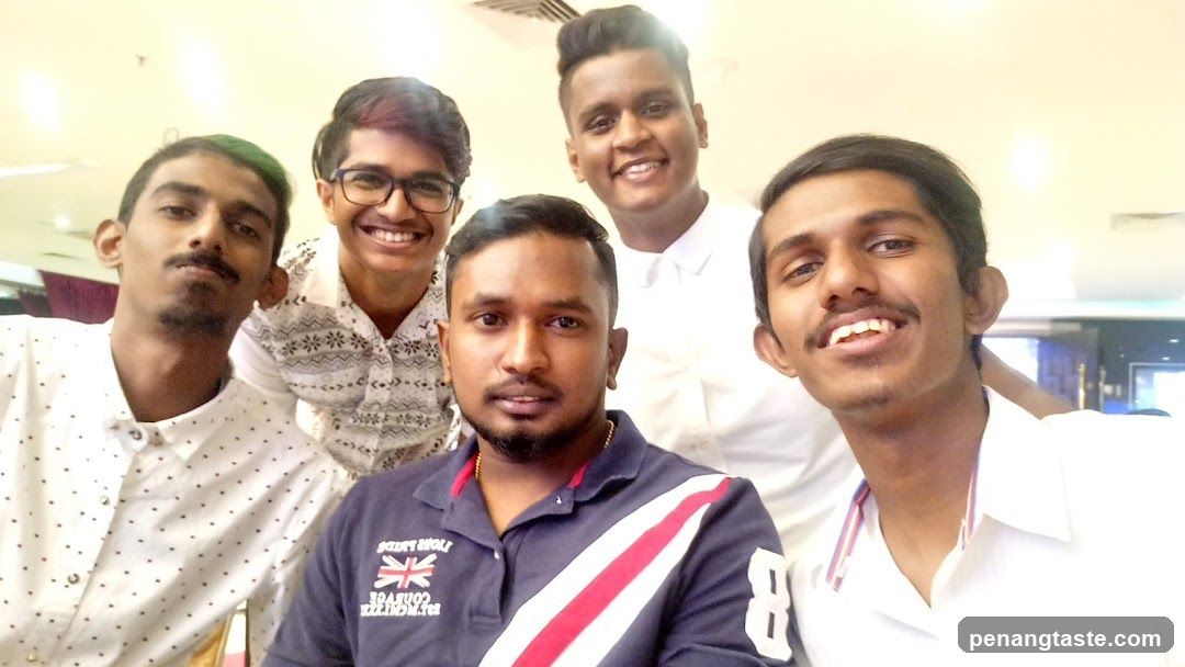 Group selfie in indoor setting