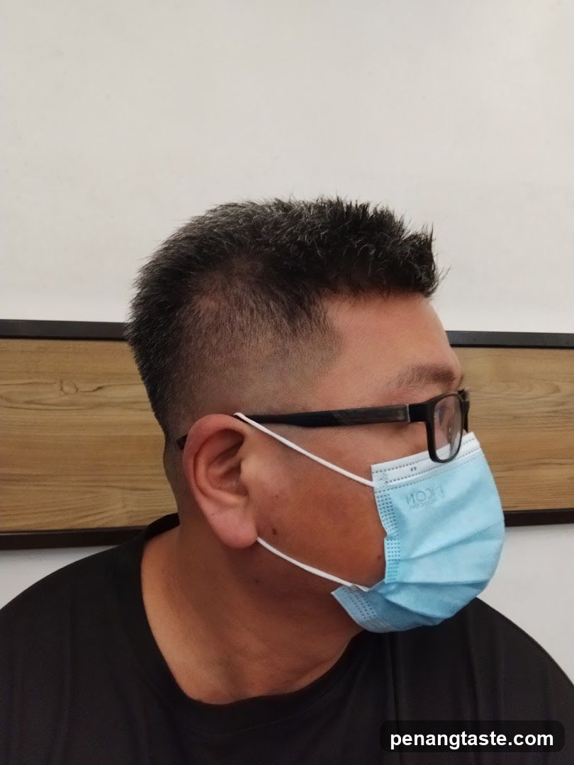 Profile of a person wearing mask and glasses