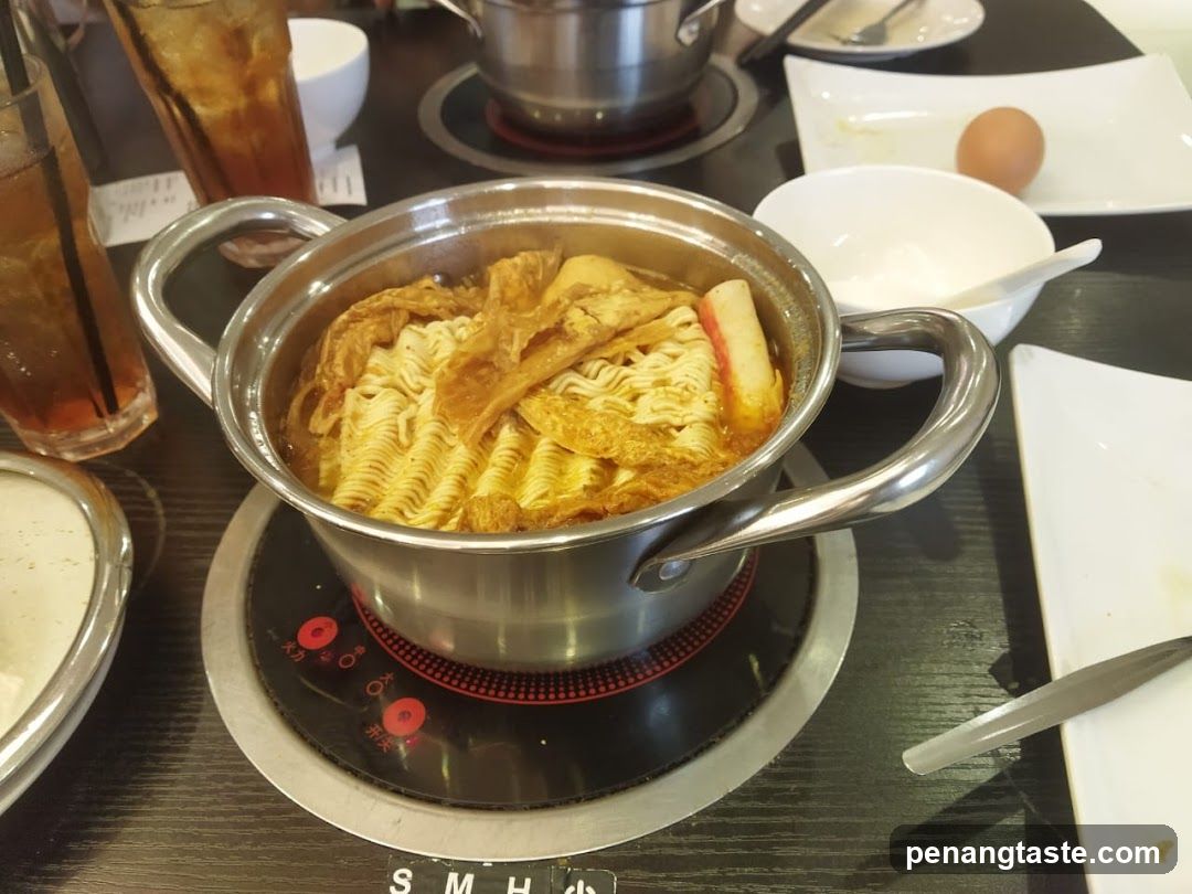 Table with hot pot noodles