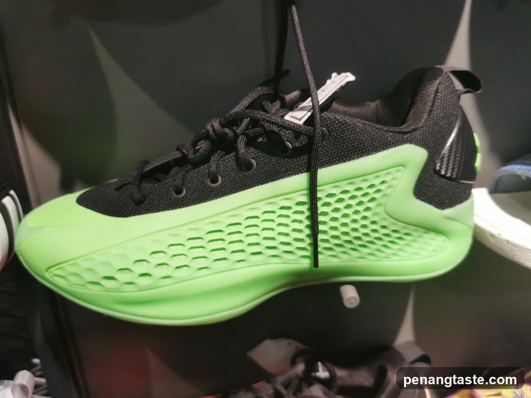 Black and neon green athletic shoe