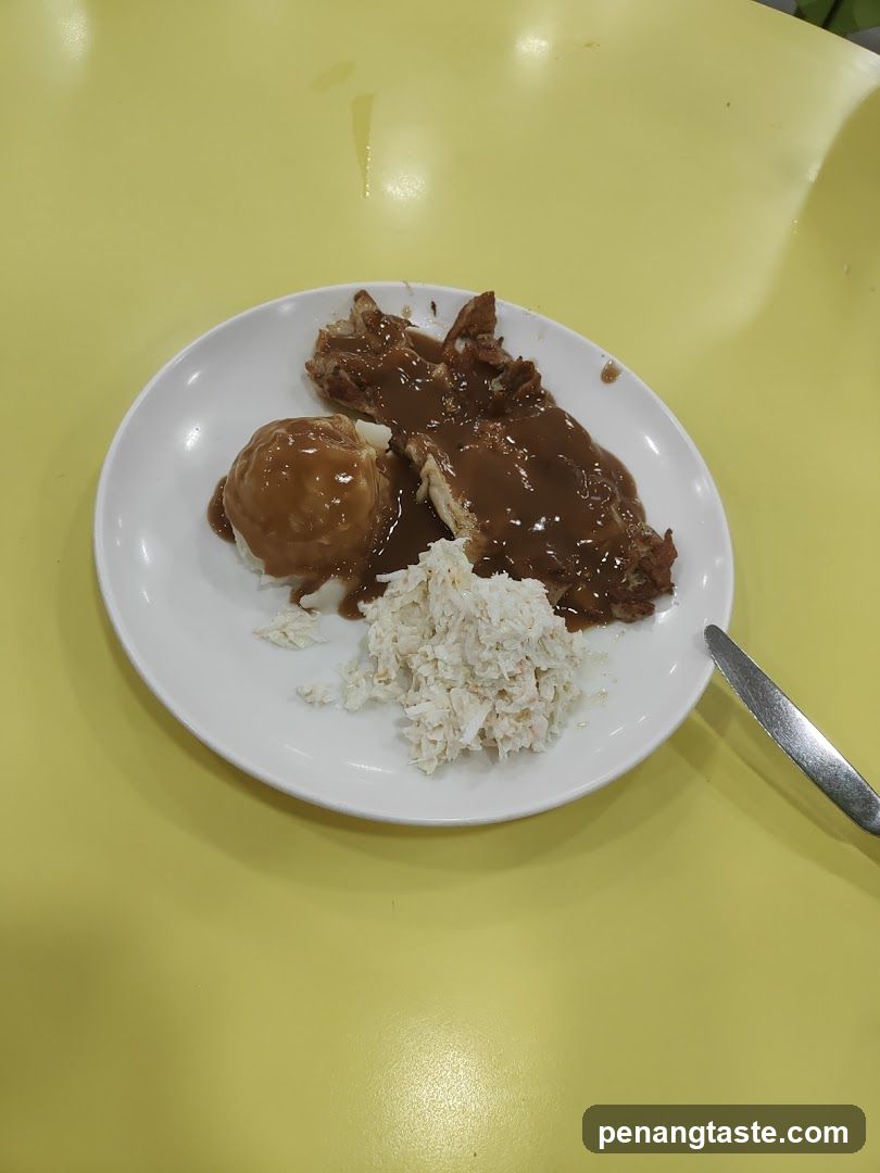 Plate of food with rice and gravy