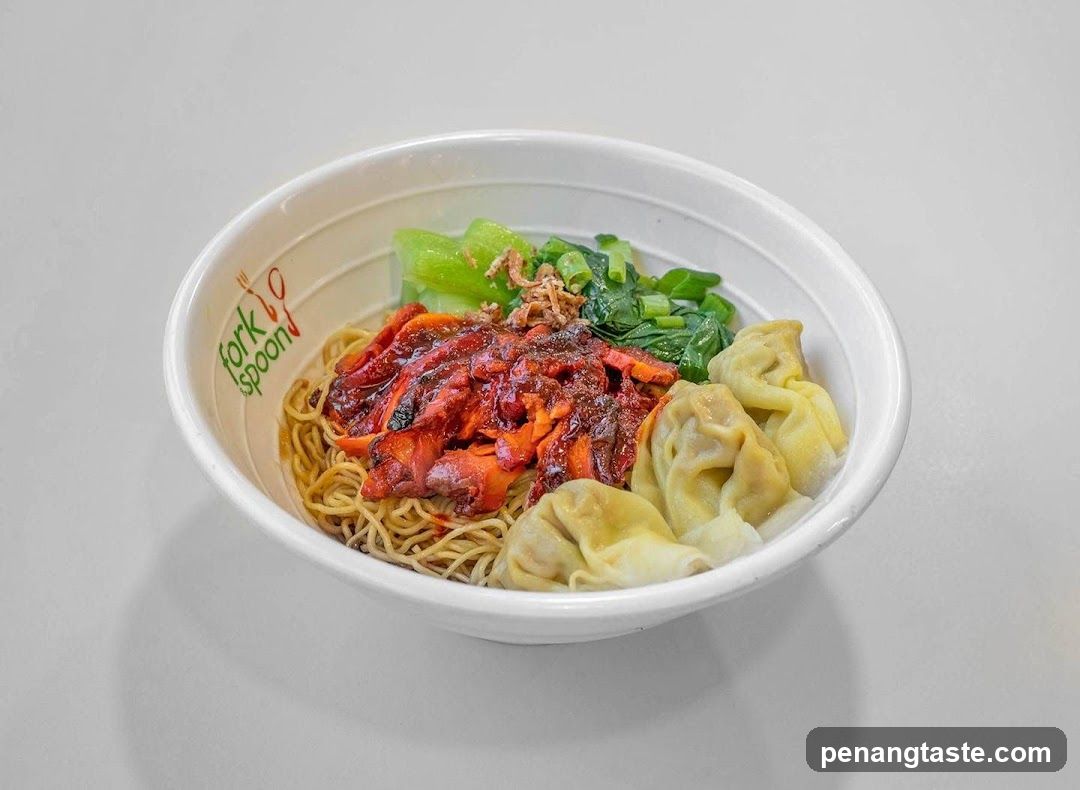 Bowl of noodles with dumplings and sauce