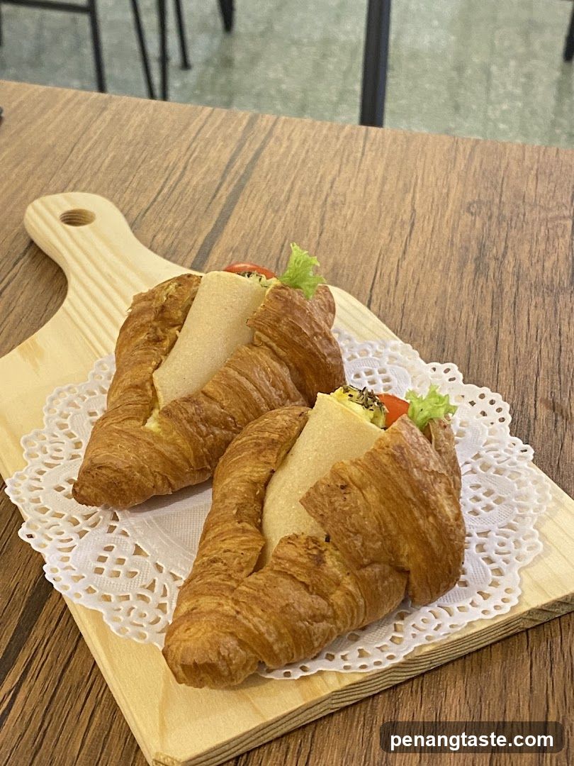 Croissant Sandwiches on Wooden Board