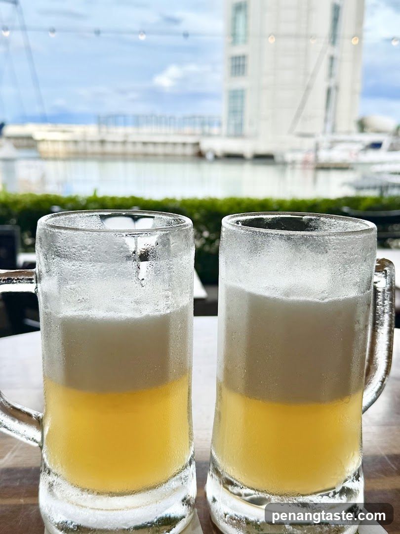 Two cold beer mugs on a table