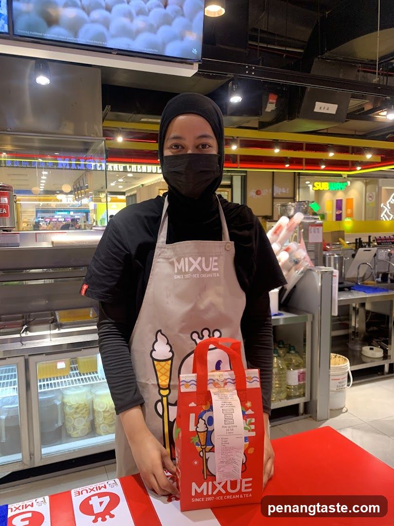 Staff at Mixue Ice Cream & Tea Counter