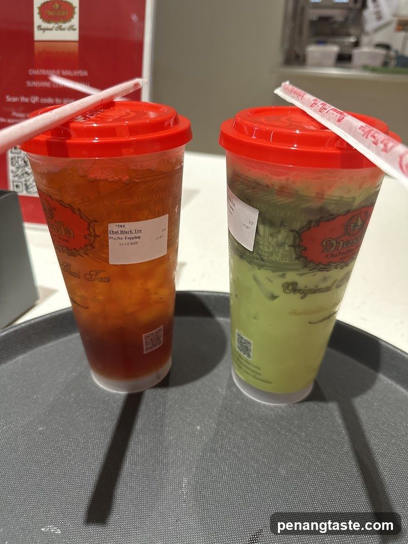 Two beverages on a tray at a tea shop
