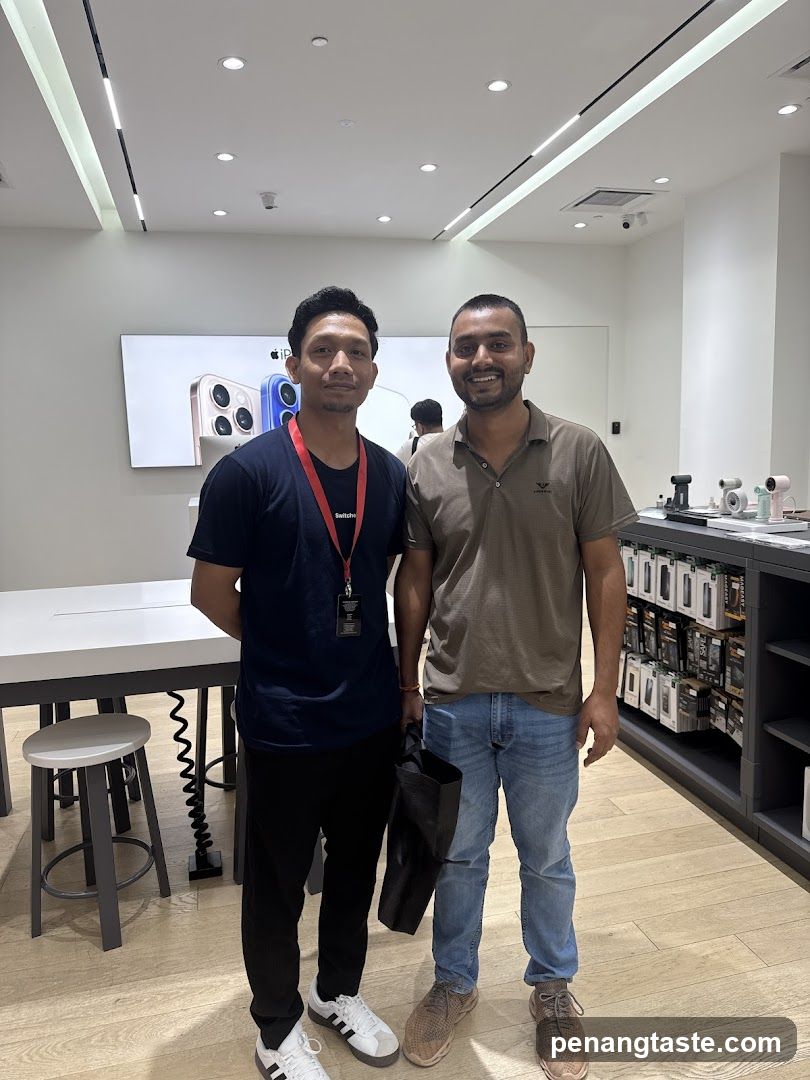 Two individuals in Apple store interior