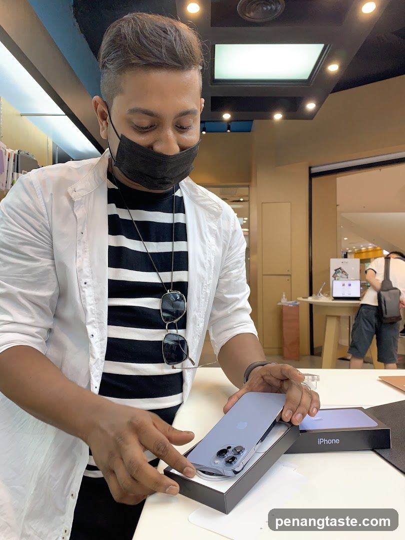 Customer examining iPhone in store
