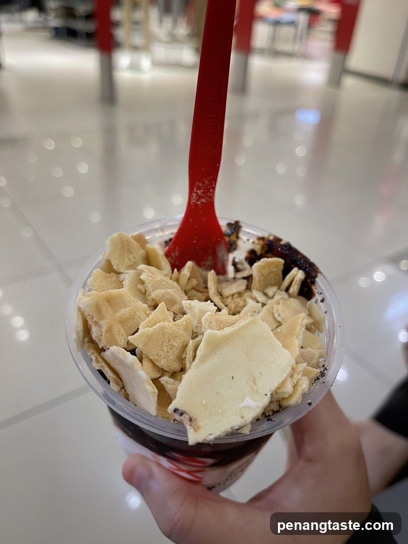 Hand holding dessert cup