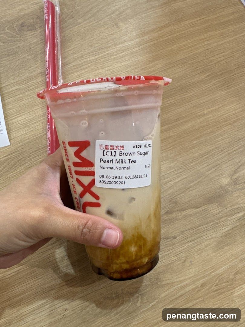 Hand holding a drink cup