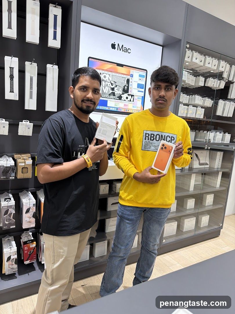 Two individuals in Apple store interior