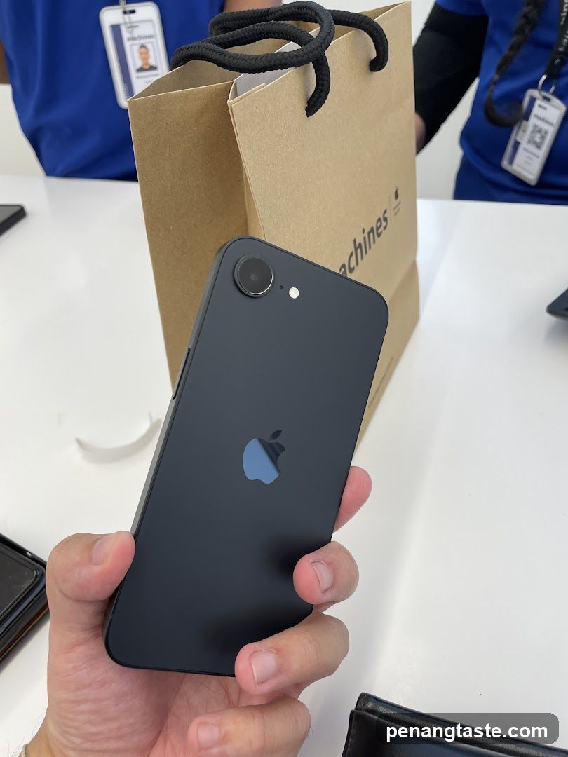 iPhone held in hand with shopping bag
