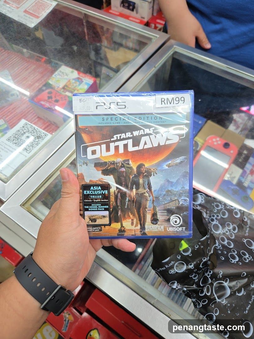 Hand holding Star Wars Outlaws PS5 game