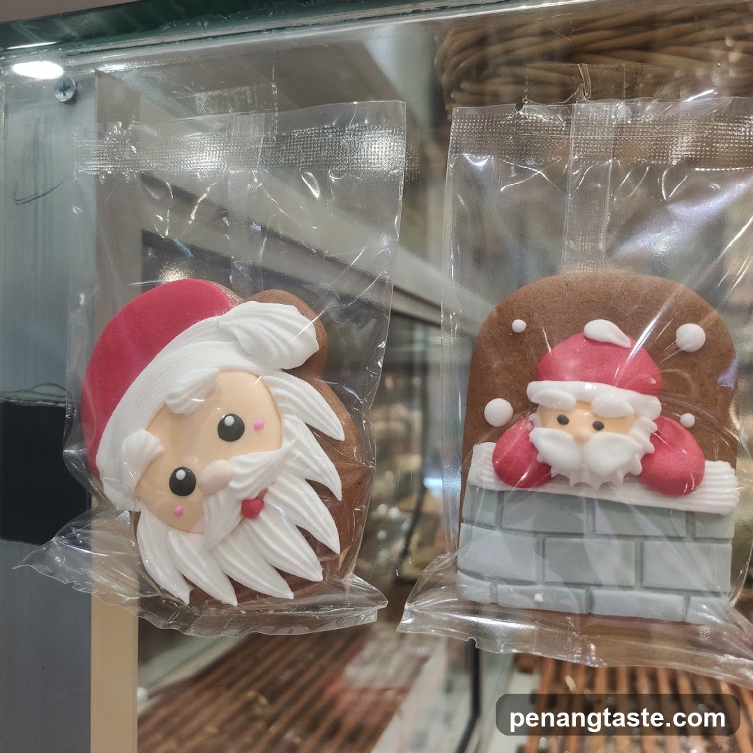 Christmas-themed cookies in display case