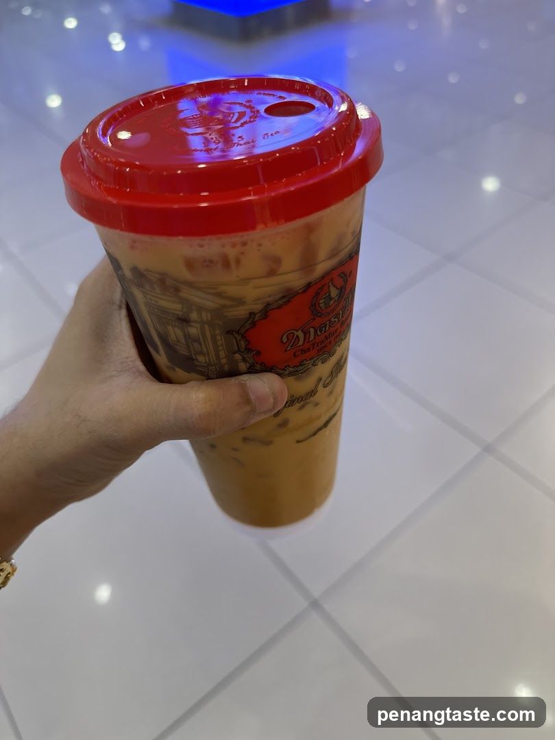 Hand holding iced tea cup