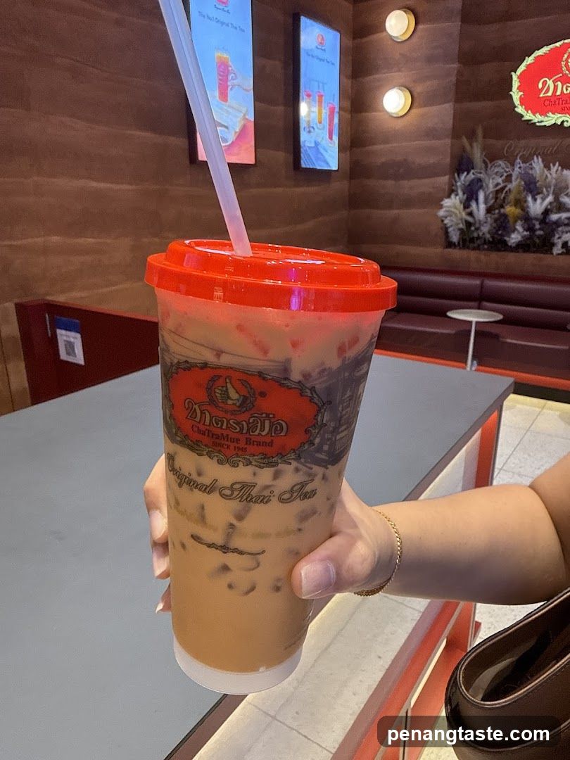 Customer holding iced tea at ChaTramue Brand store