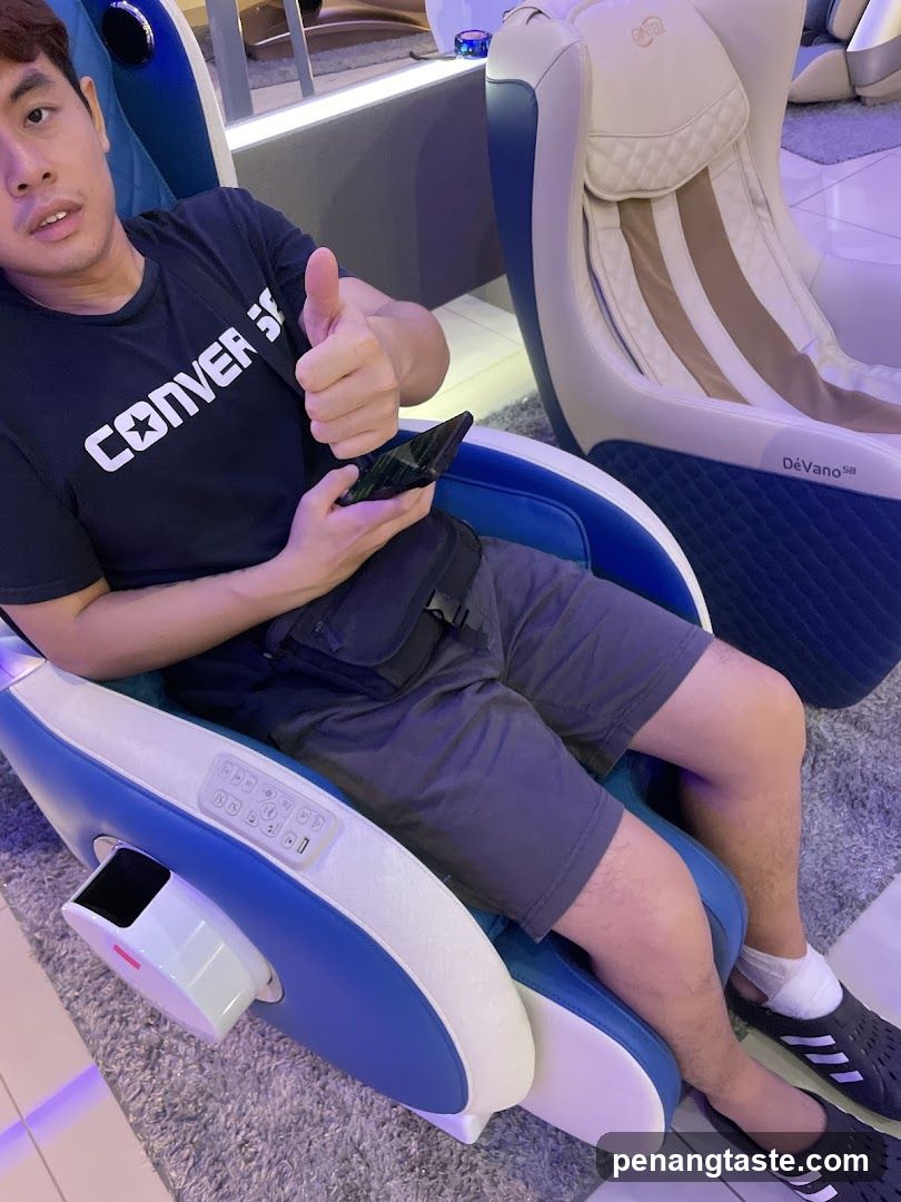 Person in massage chair showroom
