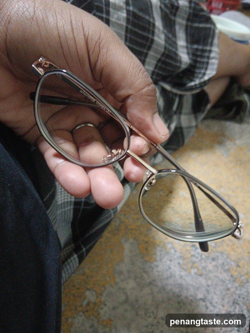 Hand Holding Glasses