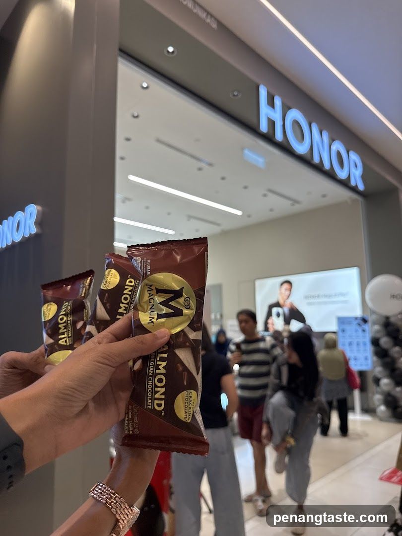 Hand holding snacks in front of store entrance