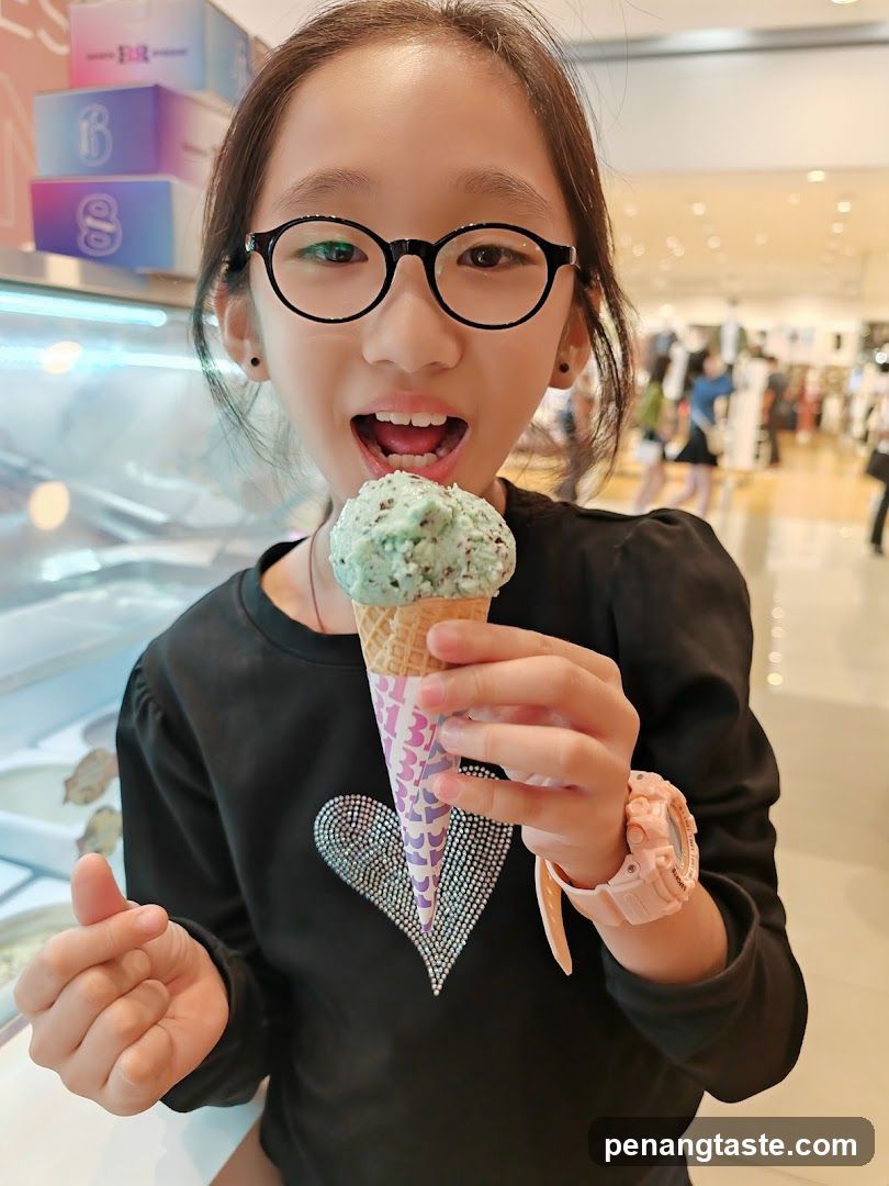 Child with ice cream in shopping mall