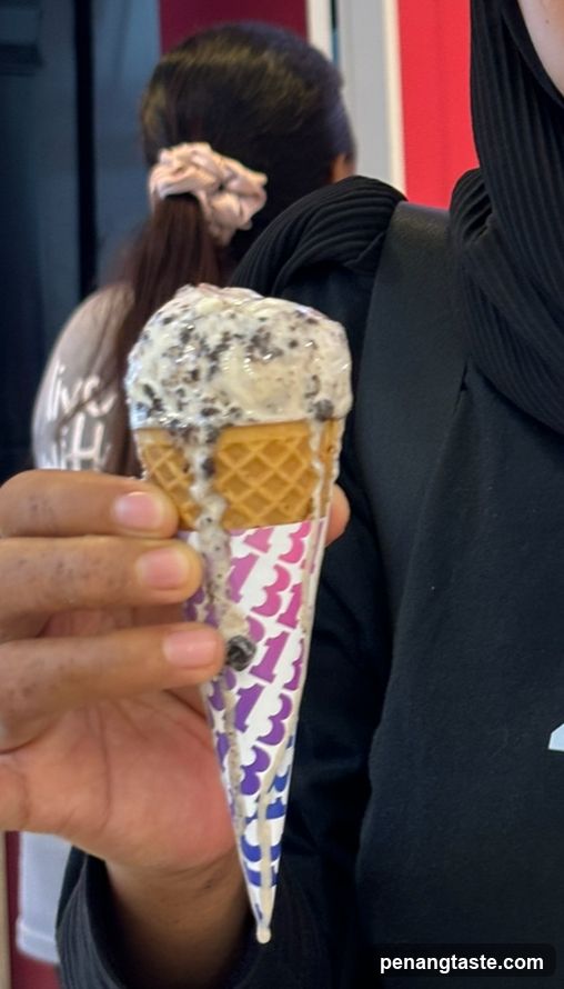 Ice Cream Cone Held in Hand