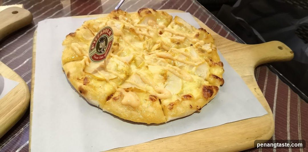 Pizza on wooden serving board
