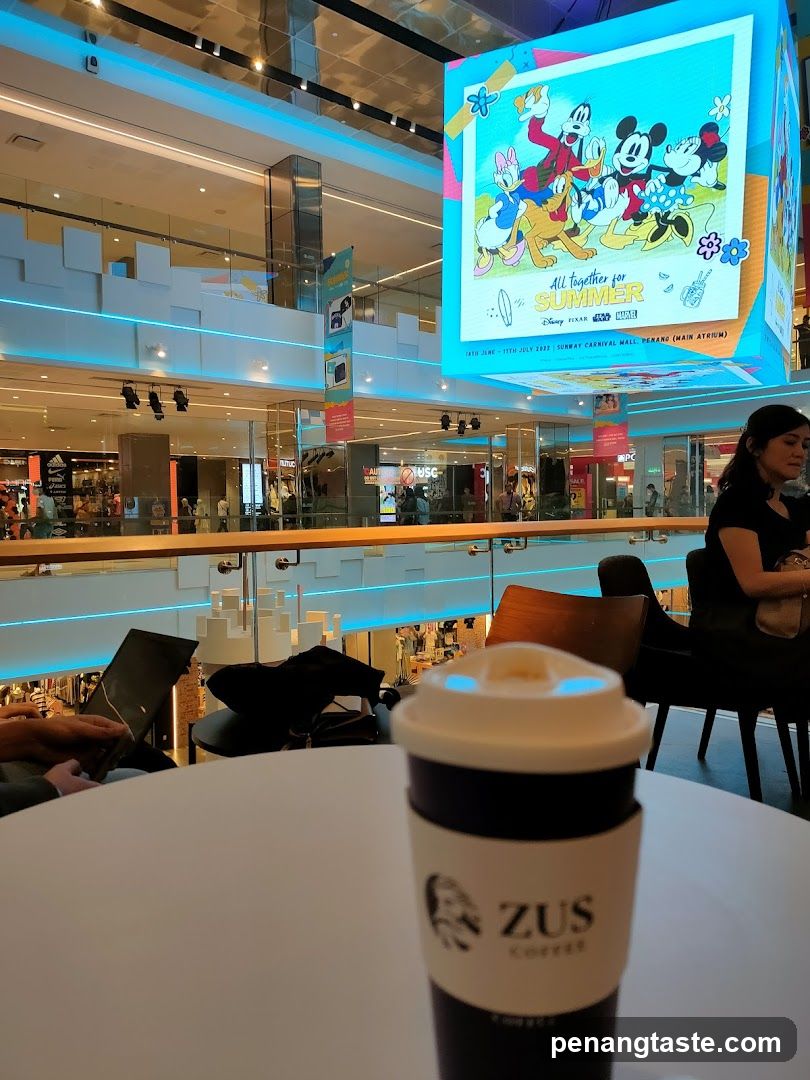 Interior of a shopping mall with café seating