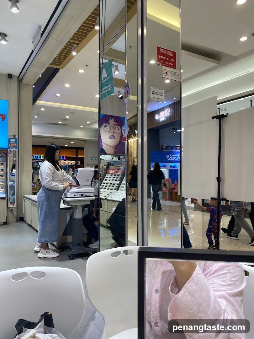 Interior of shopping mall with optical store