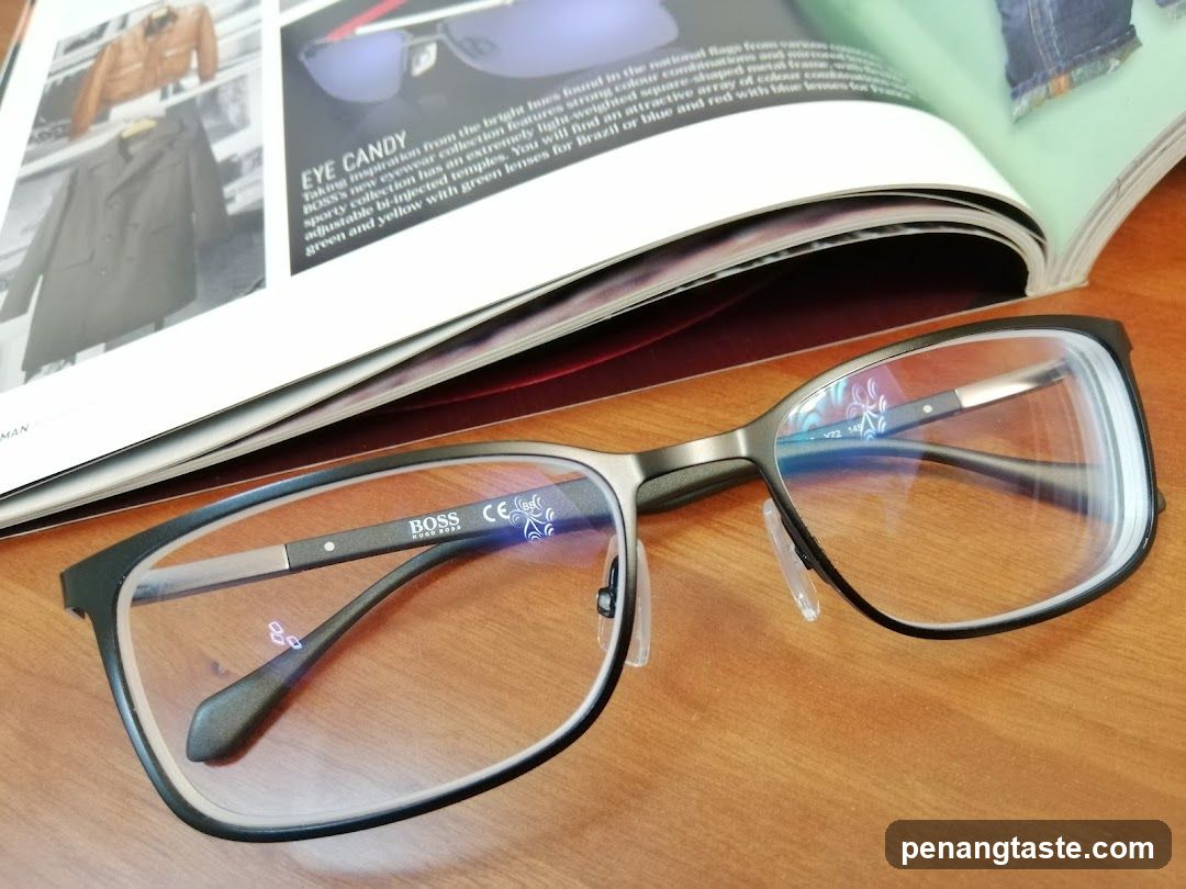 Glasses on wooden surface with magazine