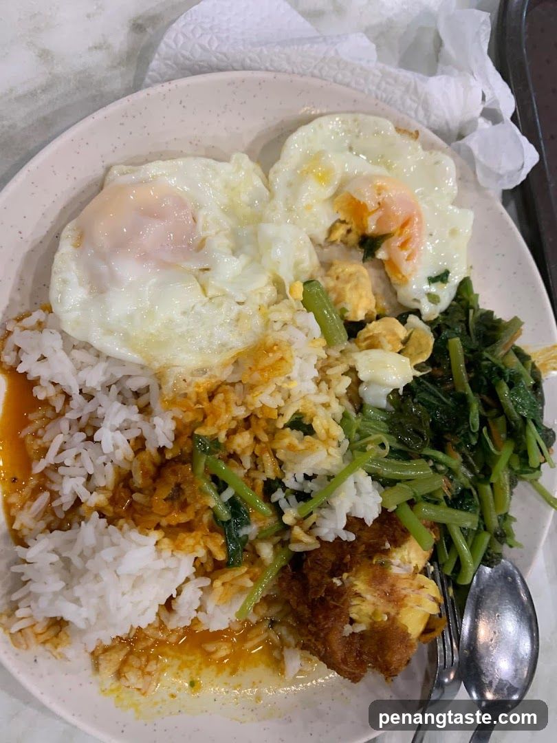 Rice plate with fried eggs and vegetables