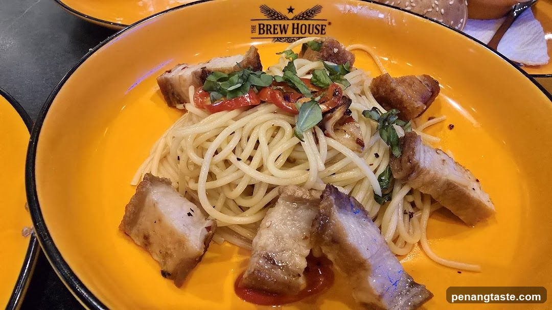 Spaghetti dish with pork and herbs