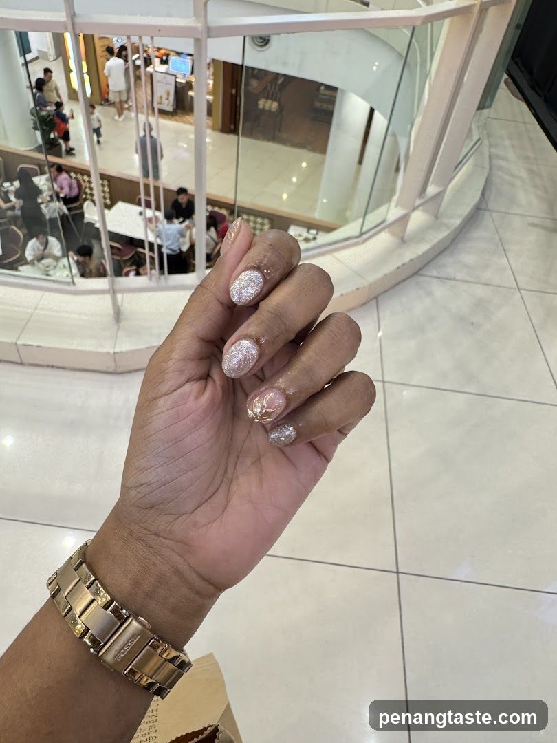 Hand with Nail Art in Mall Interior