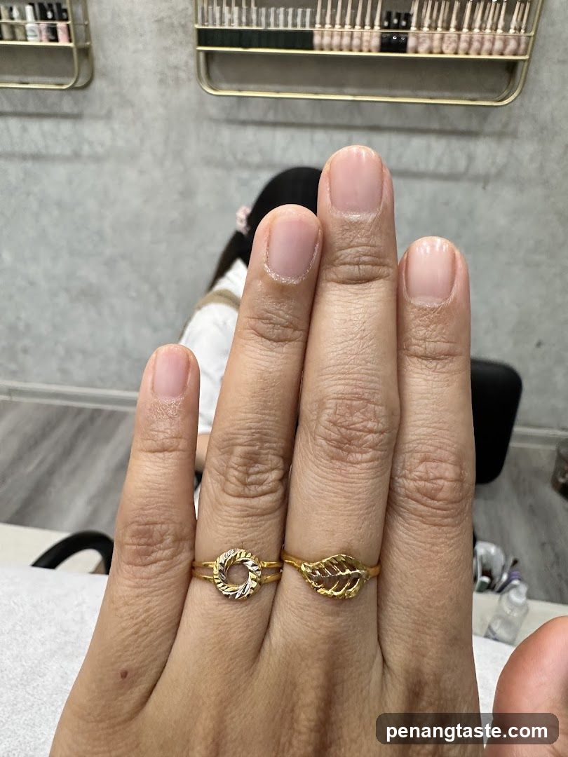Hand with Rings in Nail Salon