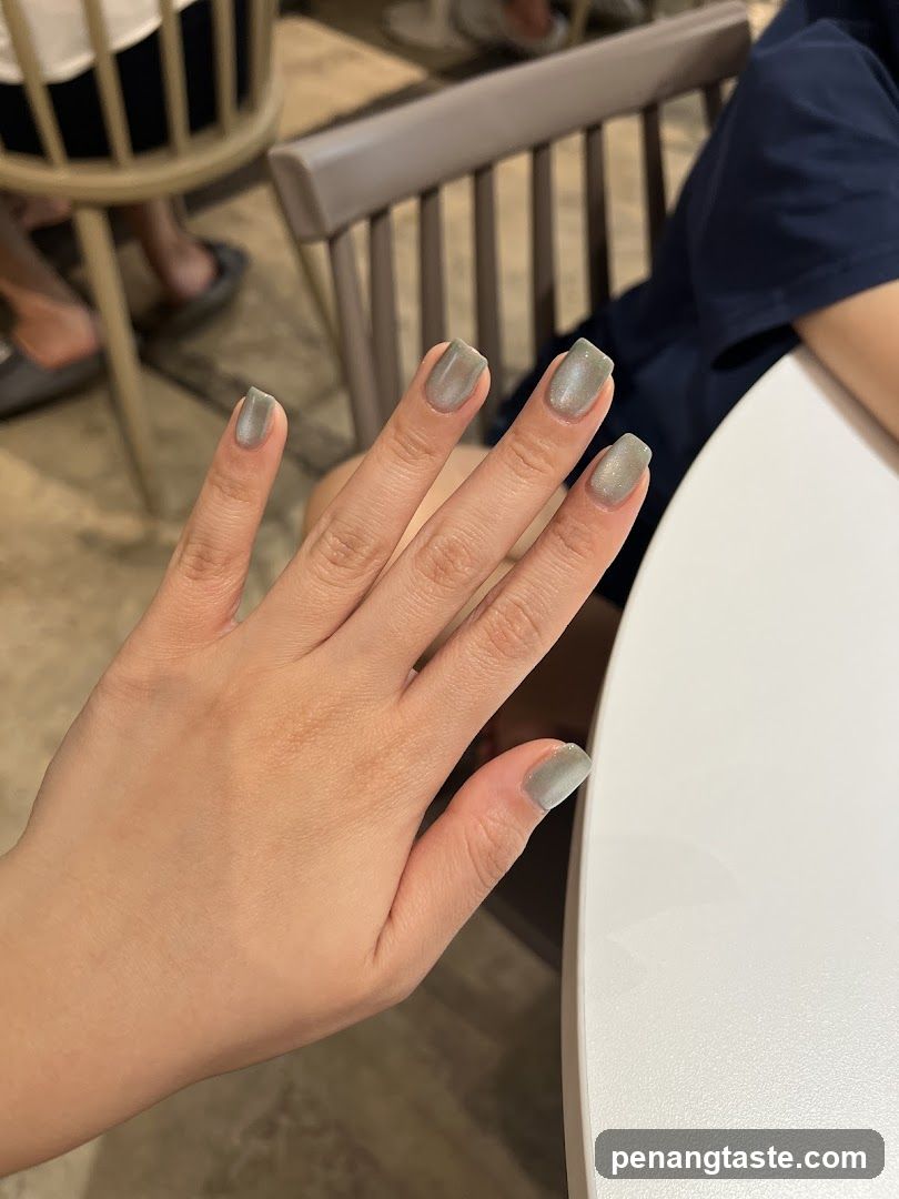 Hand with Nails in Indoor Setting