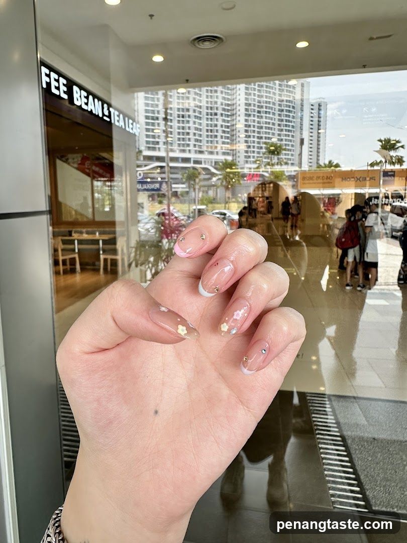 Hand with Nail Art in Mall Entrance