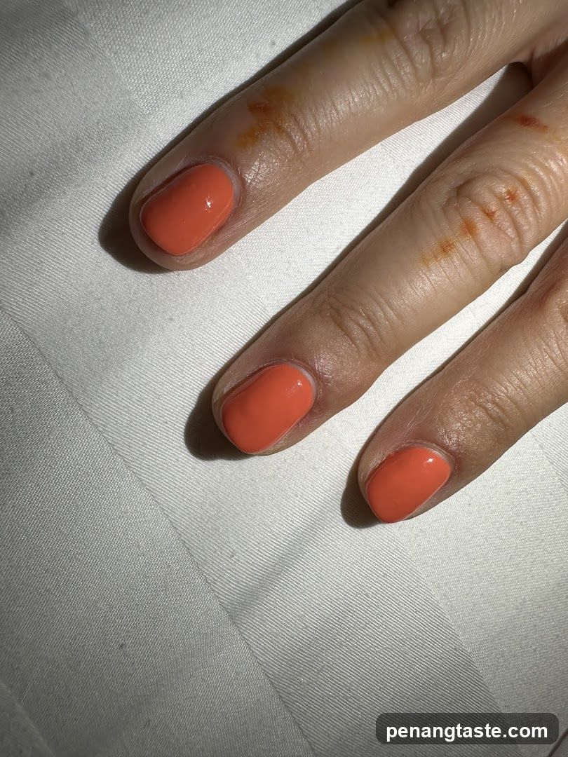 Hand with Coral Nails