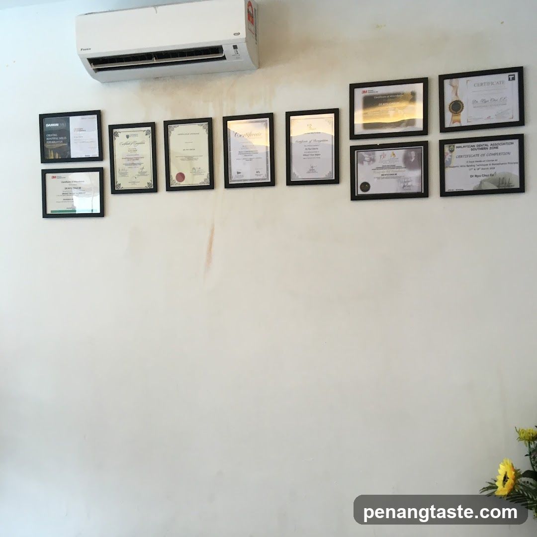 Wall with Certificates and Air Conditioner