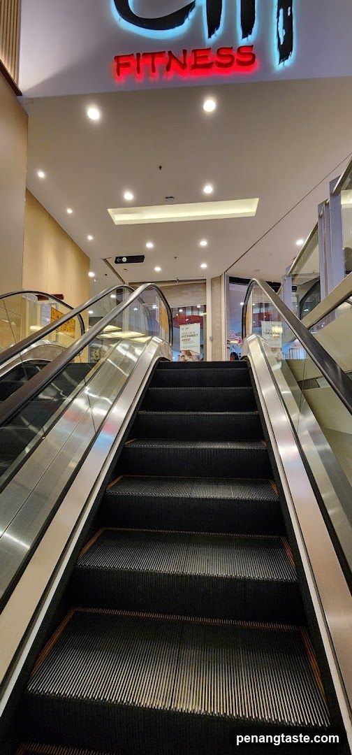 Escalator leading to fitness center