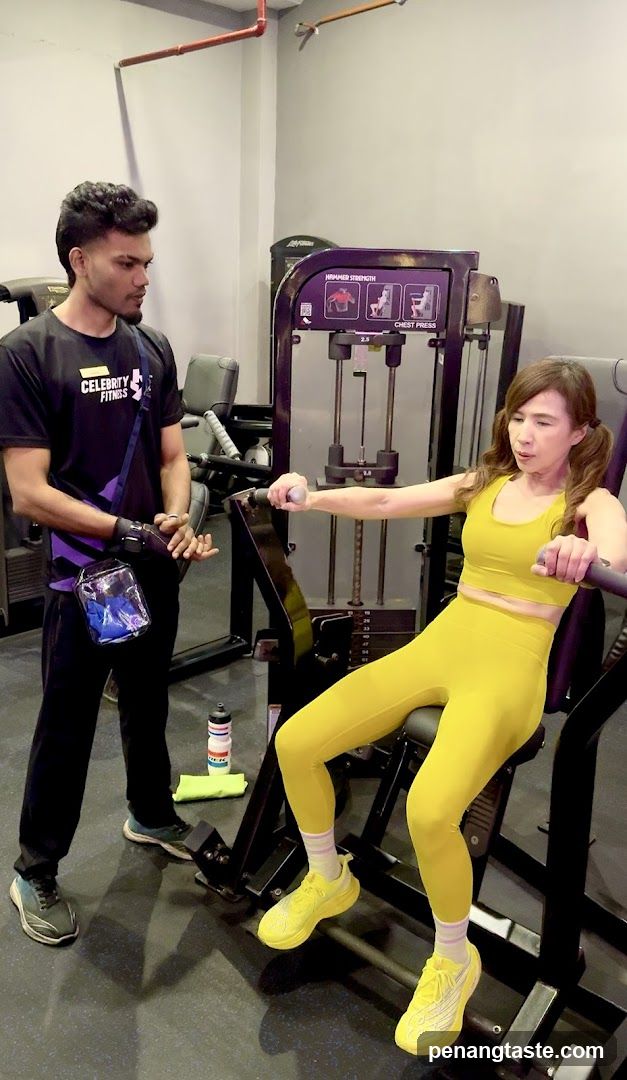 Woman Using Leg Extension Machine at Gym