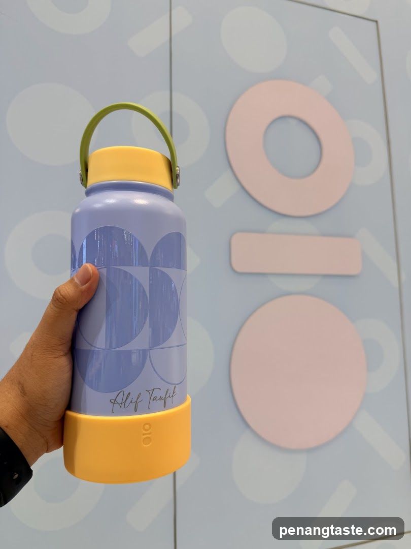 Hand holding water bottle
