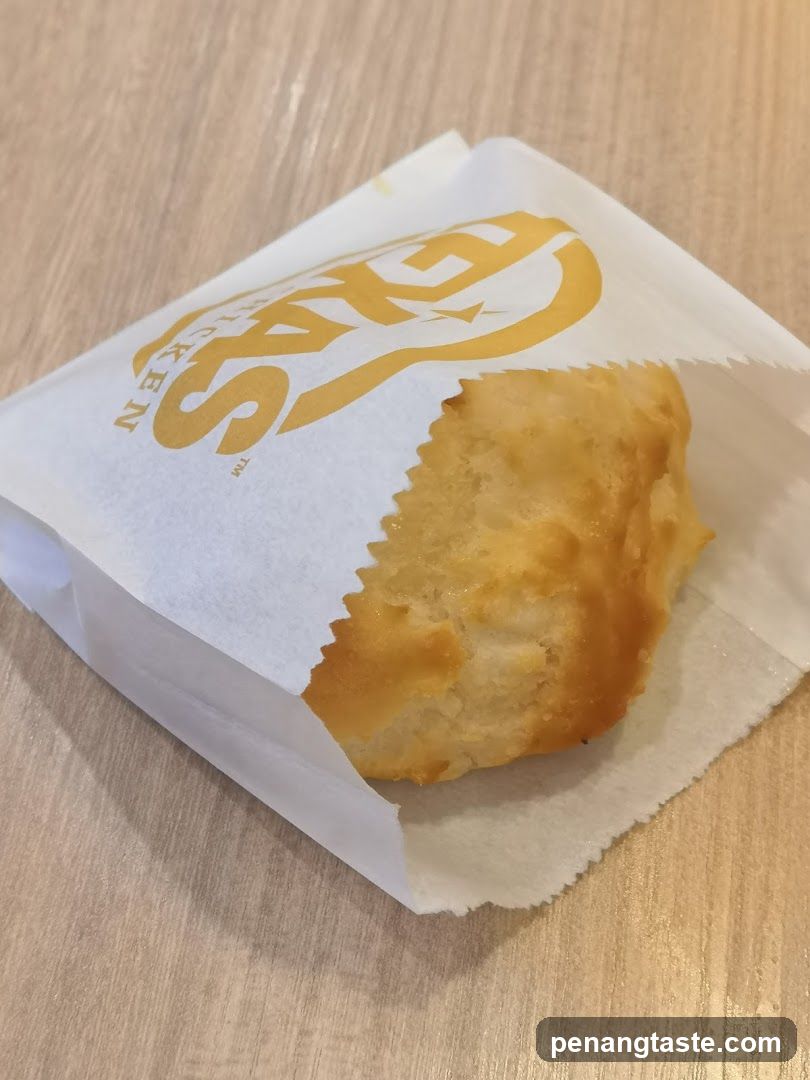 Biscuit in branded paper wrapper