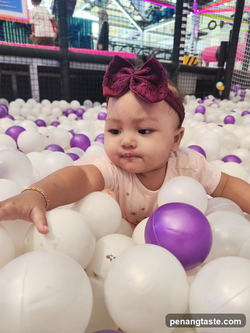 Baby in ball pit