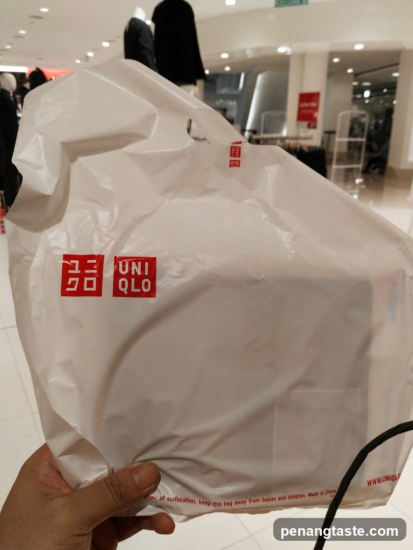 Uniqlo shopping bag inside store