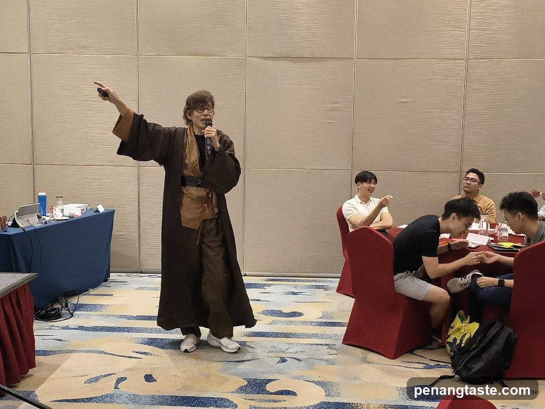 Speaker in costume addressing an audience
