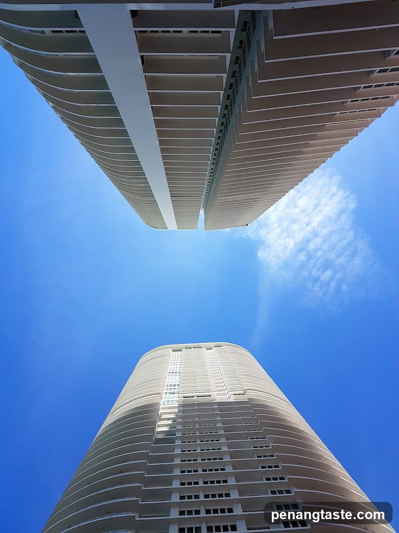 Two skyscrapers against a blue sky