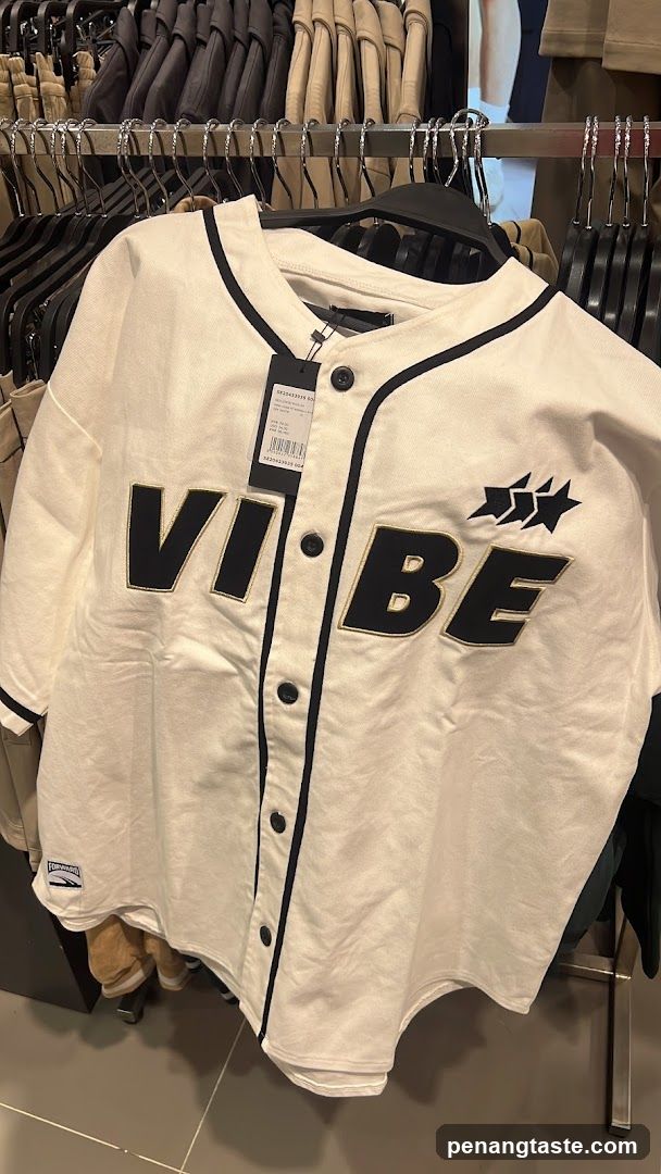 White baseball jersey with "VIBE" text